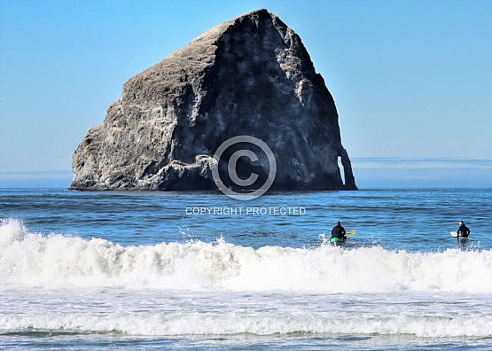 Surfers at Chief Kiawanda Rock